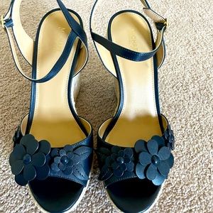 Michael Kors wedge heel with flower embellishment in navy.